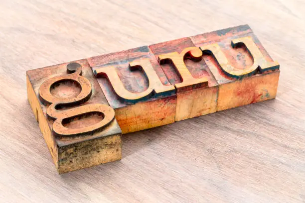 Photo of guru word abstract in wood type