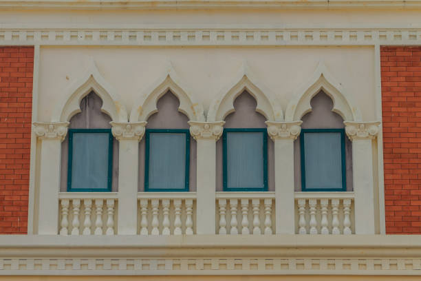 istock Row of arch windows on the balcony with stucco wall background. 905300376