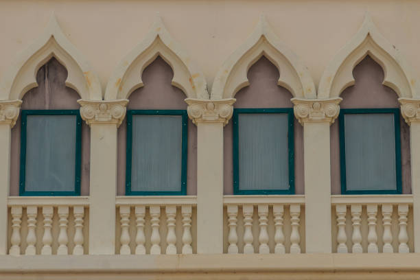istock Row of arch windows on the balcony with stucco wall background. 905300560