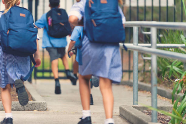 istock School children walking away. 905304730