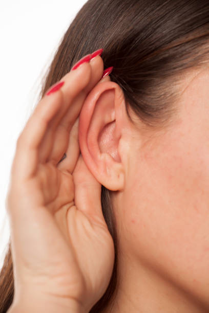 istock hand behind ear, gossip concept 905307856