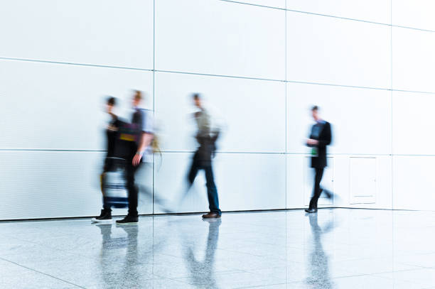 istock blurred people in a clean business environment 905314962