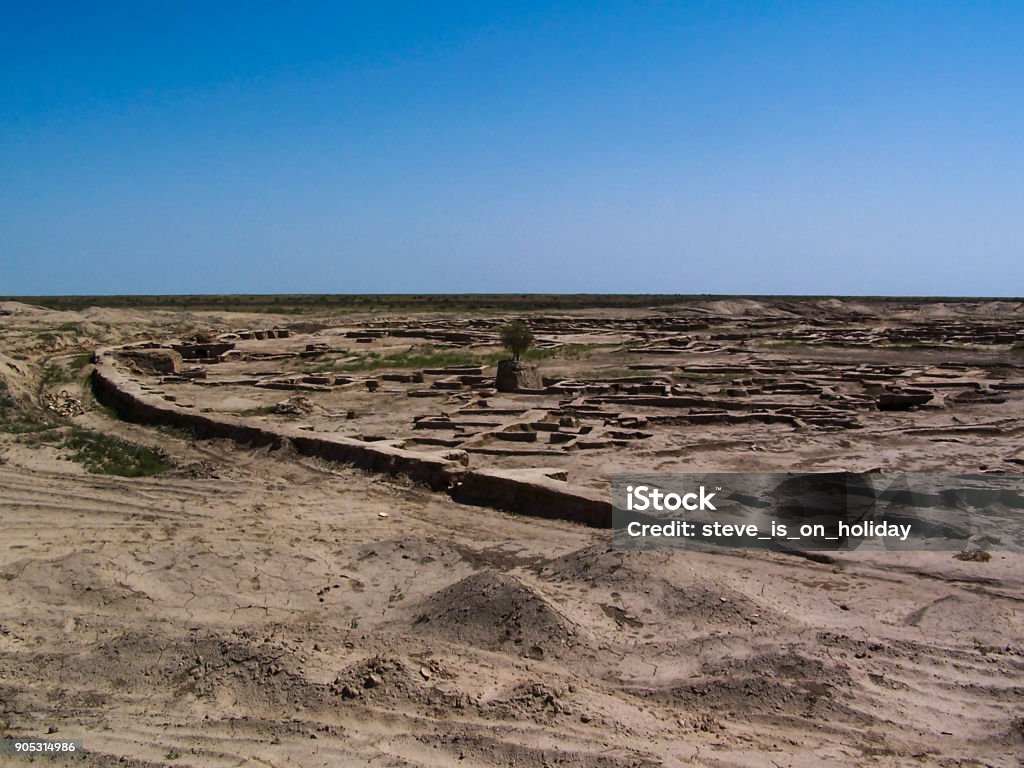 Gonur Tepe Bronze Age City in Turkmenistan The low ruins of the bronze age city of Gonur Tepe (or Gonur Depe) in the desert north of Mary, in modern Turkmenistan. Ancient Stock Photo