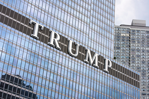 Chicago, Illinois,  United States - June 16, 2017: Trump Tower is a retail, office and residential skyscraper in a downtown of Chicago. The Trump tower is one of the most prominent buildings on the riverwalk in the loop.