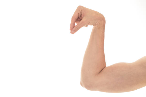 Close-up of a man's fist. Strong and power man's hand with muscles and veins. Studio shooting.