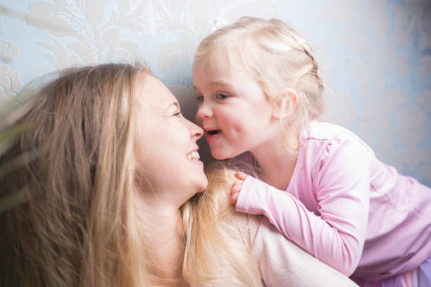 istock Mother and daughter hugging 905319504