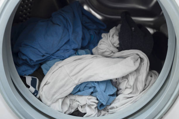 istock Fresh, clean, wet laundry in washing machine 905322774