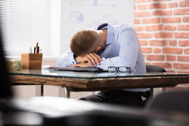 istock Businessman Sleeping Over The Desk 905323292