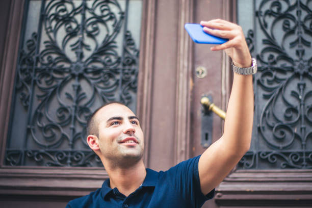 istock Young man make selfie outdoor. 905328608