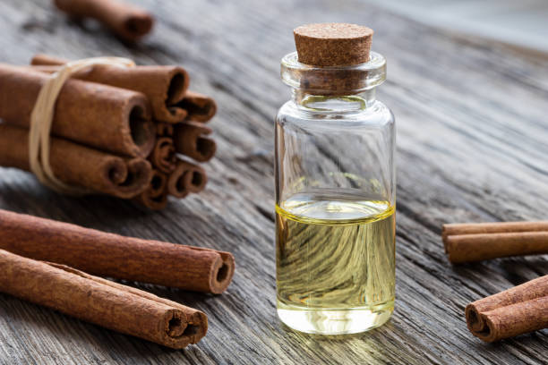 istock A transparent bottle of cinnamon essential oil with cinnamon sticks 905329190