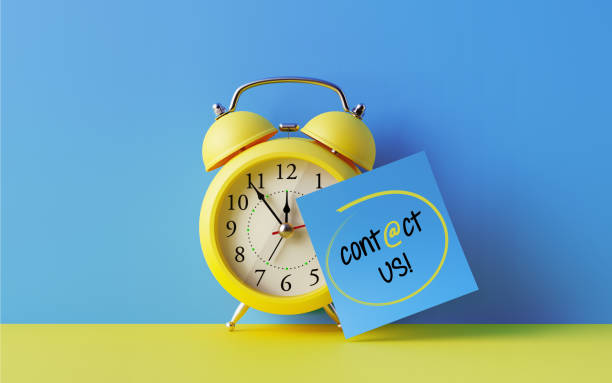 istock Alarm Clock And A Blue Post It Not Over Blue Background 905329598