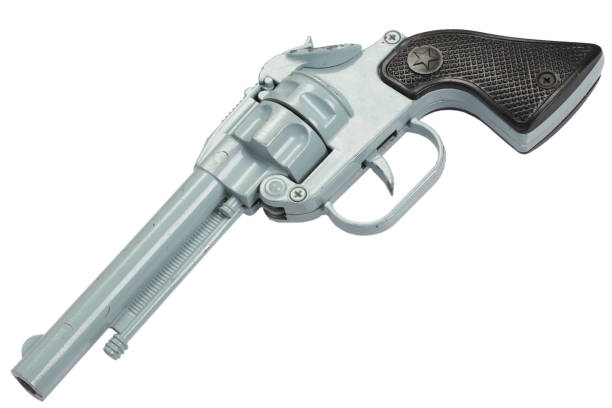istock old retro toy pistol isolated on a white background 905332520