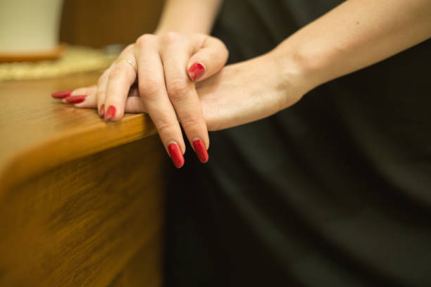 istock Woman hands red nail polish background 905333548