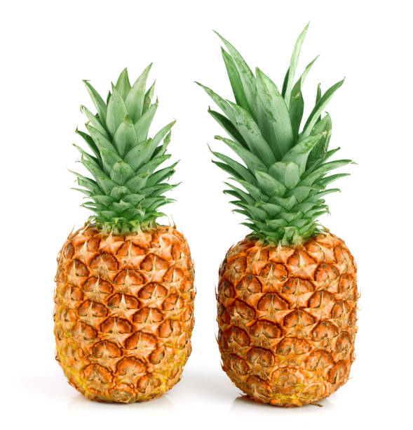 istock Two ripe pineapple isolated on white background 905335758