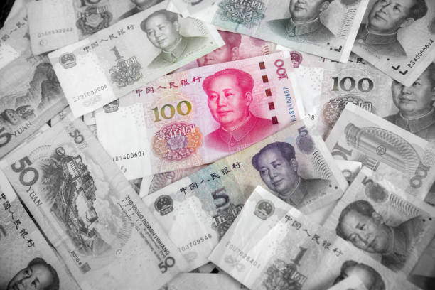 China yuan note a background.Pile of various currencies isolated on white background. China yuan note a background.Pile of various currencies isolated on white background.China currency.money of Chinese mao original stock pictures, royalty-free photos & images