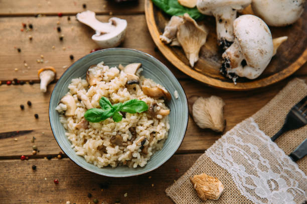 istock delicious rice with mushrooms and rosemary, risotto. 905335910