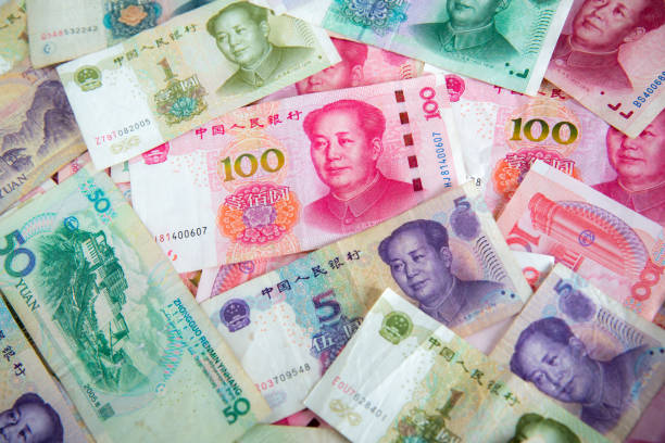 China yuan note a background.Pile of various currencies isolated on white background. China yuan note a background.Pile of various currencies isolated on white background.China currency.money of Chinese mao original stock pictures, royalty-free photos & images