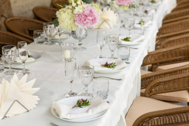 istock Decoration and table appointments in restaurant or cafe for lunch, dinner or celebrating marriage, wedding and other event and party. Beautiful table setting 905336584