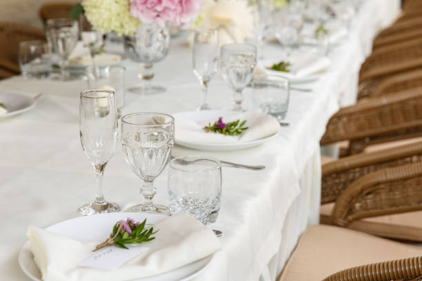 istock Decoration and table appointments in restaurant or cafe for lunch, dinner or celebrating marriage, wedding and other event and party. Beautiful table setting 905336634