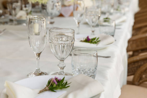 istock Decoration and table appointments in restaurant or cafe for lunch, dinner or celebrating marriage, wedding and other event and party. Beautiful table setting 905336694