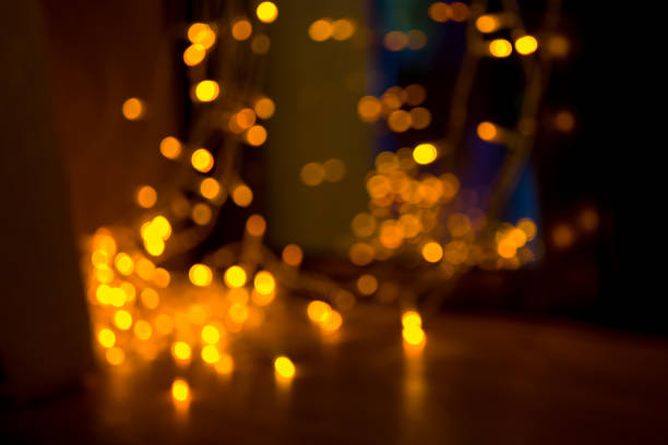 istock blurred dark background with bright bokeh orange-yellow 905336880