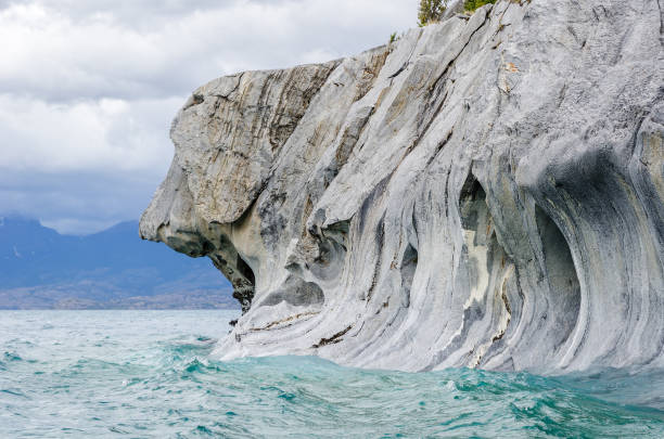 Marble Caves of Lake General Carrera, Chile, Natural sculpture like a dog Marble Caves of Lake General Carrera, Chile, near Puerto Rio Tranquilo, Catedral del Marmol marble caves patagonia chile stock pictures, royalty-free photos & images