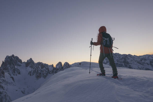 istock Brave woman discovering alpine mountains alone at dusk 905342752
