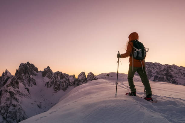 istock Young female exploring extreme Alpine terrain in winter 905342780