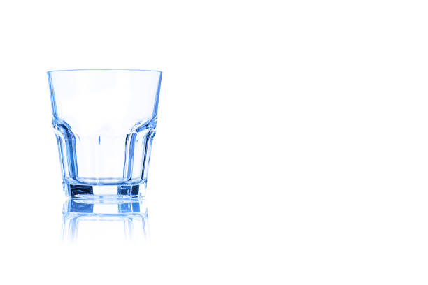 istock Empty glass for whiskey toned in blue color. 905346610