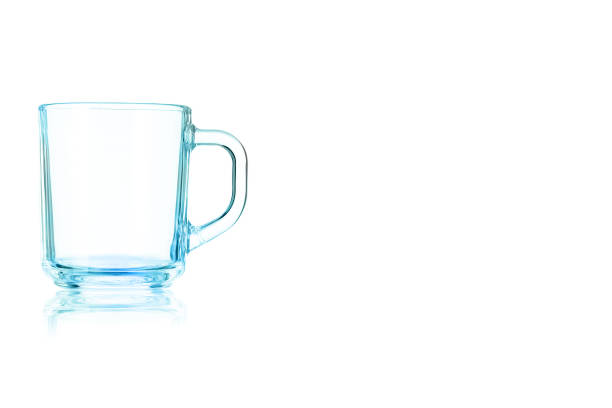 istock Empty glass mug toned in blue color. 905347366