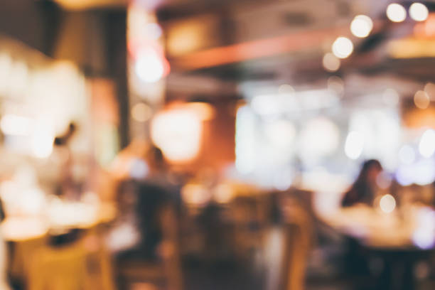 istock Restaurant cafe or coffee shop interior with people abstract blur background 905347692