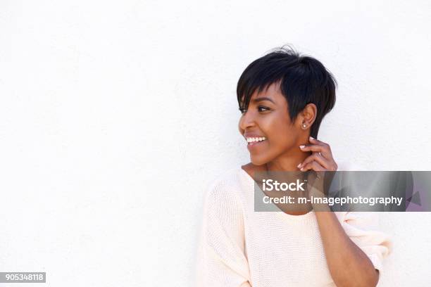 Beautiful Young African Woman Smiling By White Background Stock Photo - Download Image Now