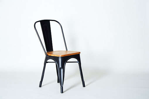 Steel chair with light wood on a white background