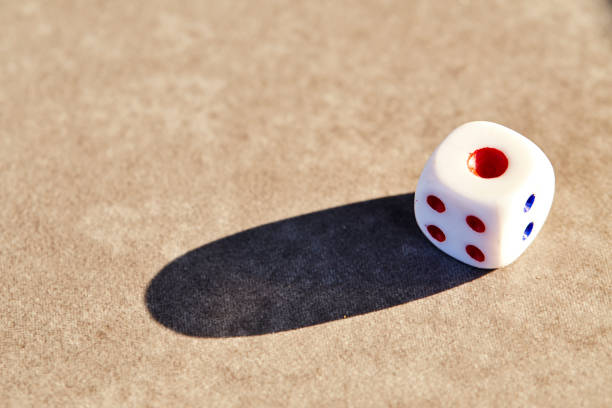 istock Closeup of a single white dice 905355166