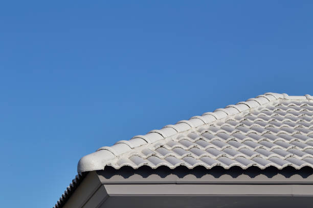 istock Gray tile roof against the blue sky. Construction 905355198