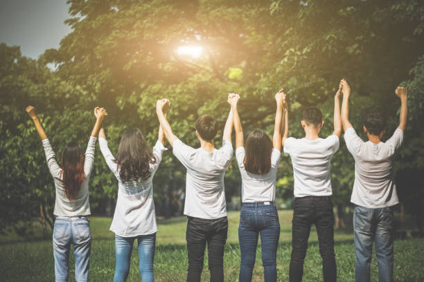 istock Group of friend put their hands up for cheer up teamwork 905357646
