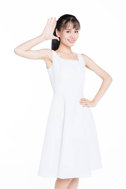 istock young woman making a gesture standing over white background 905364550