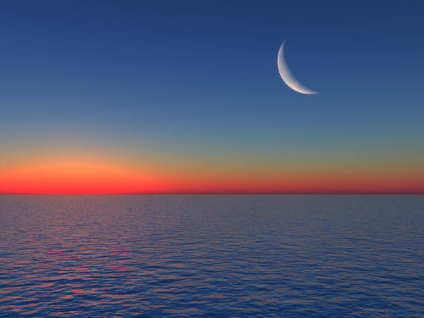 istock Sunrise over Sea with Moon 905369352