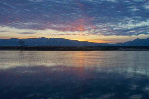 istock Sunrise and the water surface 905374772
