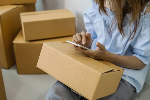 istock Young woman working online business by using smart phone 905375094