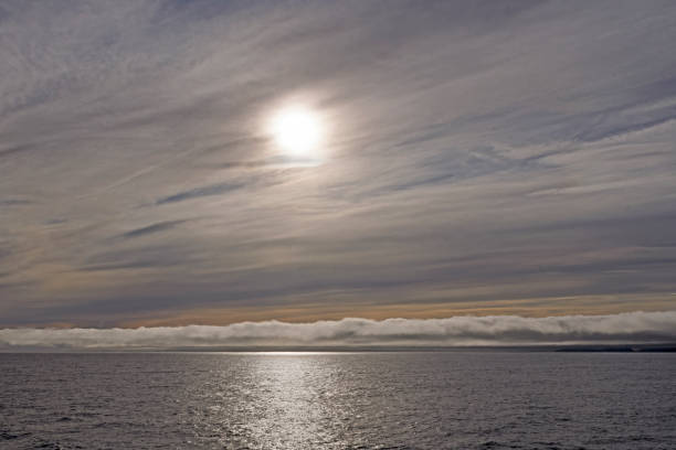 High and Low Clouds on the Ocean near Baffin Island in Nunavut, Canada