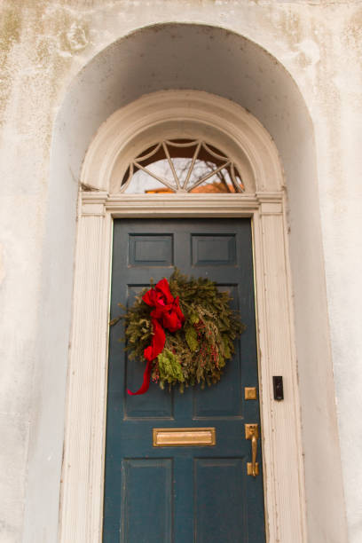 istock Navy Door with a Christmas Wreath 905386520