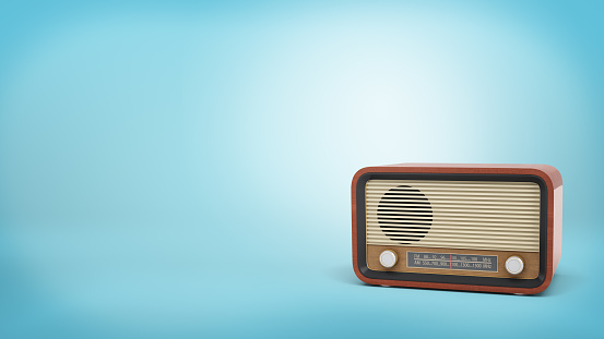 Render 3D de radio estilo retro en color marrón con un altavoz y botones del sintonizador se encuentra sobre fondo azul photo