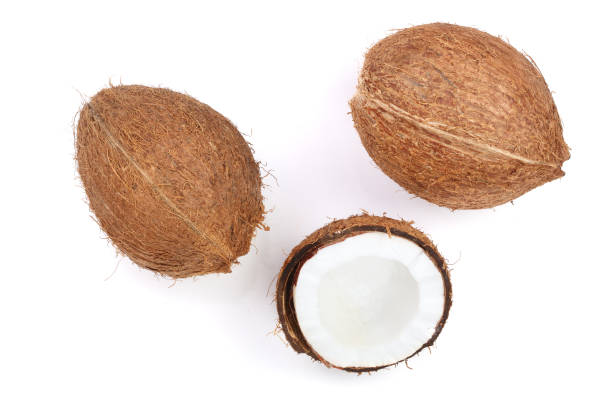 istock whole coconut with half isolated on white background. Flat lay. Top view 905393486