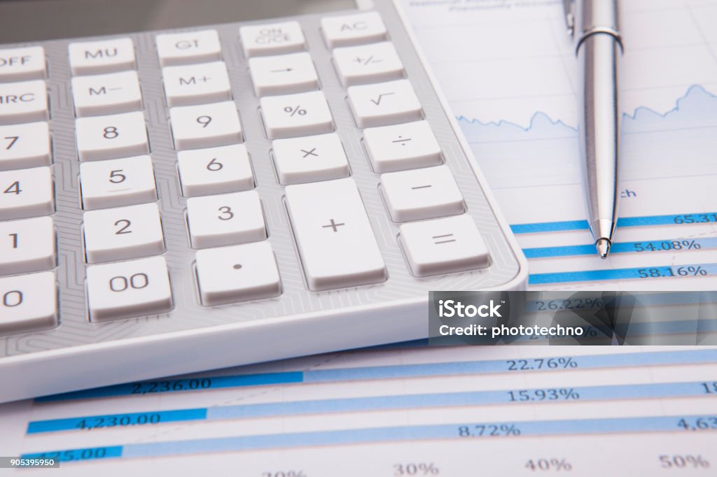 Calculator, pen and business balance Finance Stock Photo