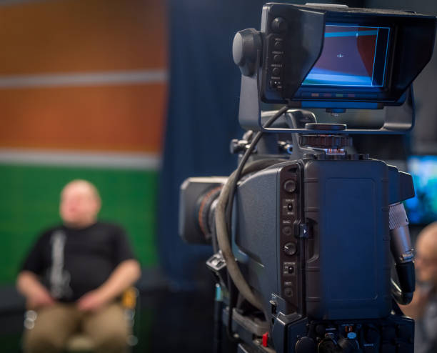 istock TV operators install video cameras 905396108