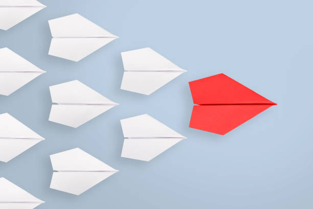 istock Leadership concepts with blue paper airplane 905396290