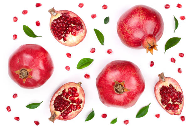 istock pomegranate with leaves isolated on white background. Top view. Flat lay pattern 905400242