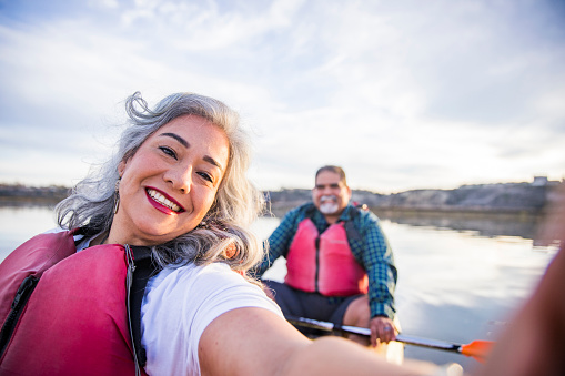 Senior Mexican Couple Kayaking Taking a Selfie