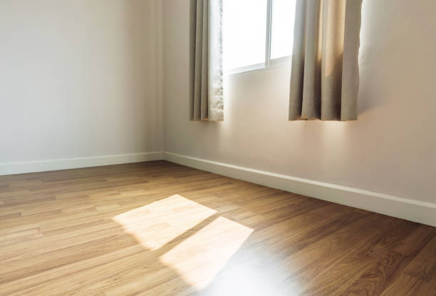 Interior space, empty room, laminate wooden floor with opened window receiving sunlight in the morning Interior space, empty room, laminate wooden floor with opened window receiving sunlight in the morning parquet floor perspective stock pictures, royalty-free photos & images